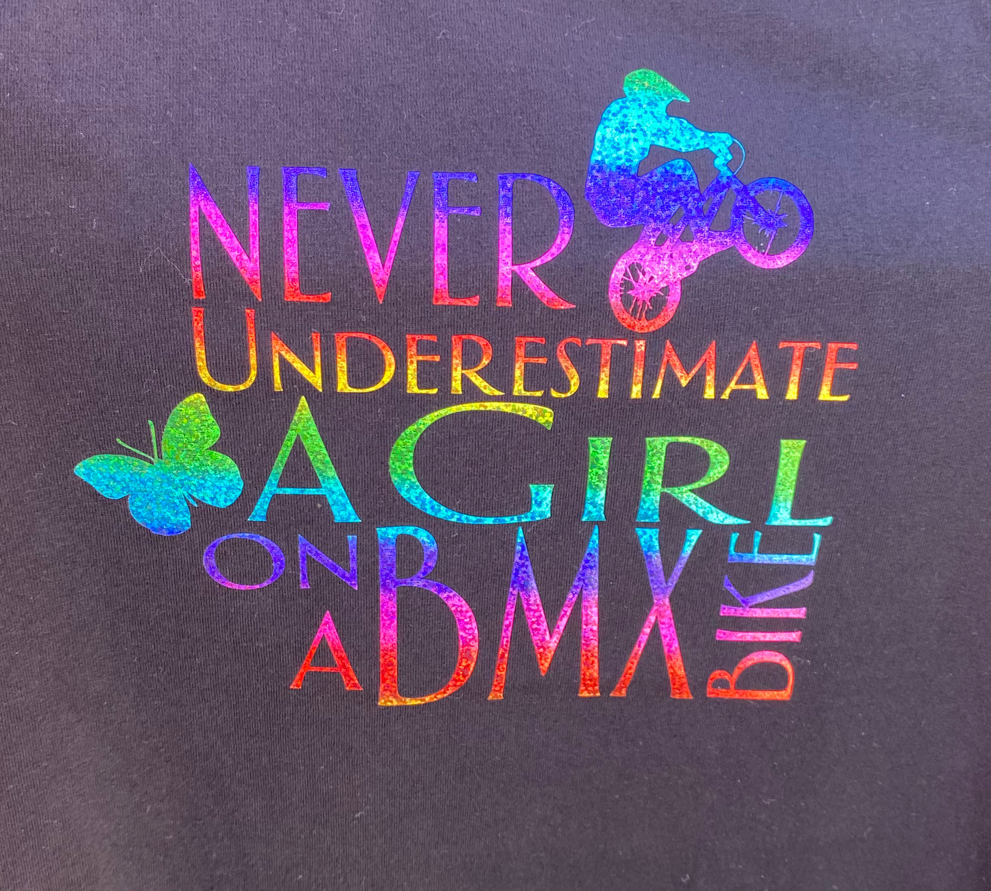 Never Underestimate a Girl - Rainbow glitter print